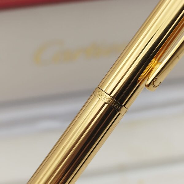 513550 3 BOLIGRAFO CARTIER TIRINITY GOLD PLATED AÑO 2002 + ESTUCHE + PAPELES