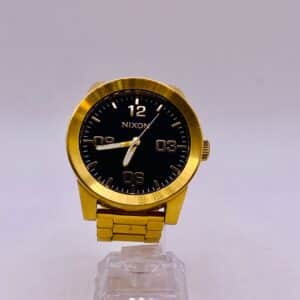 RELOJ NIXON THE CORPORAL DORADO